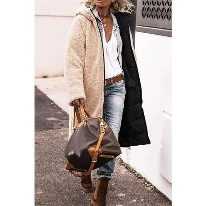 Stylish women's hooded reversible winter jacket with thick padding and elegant quilting, designed for warmth and fashion in winter seasons.