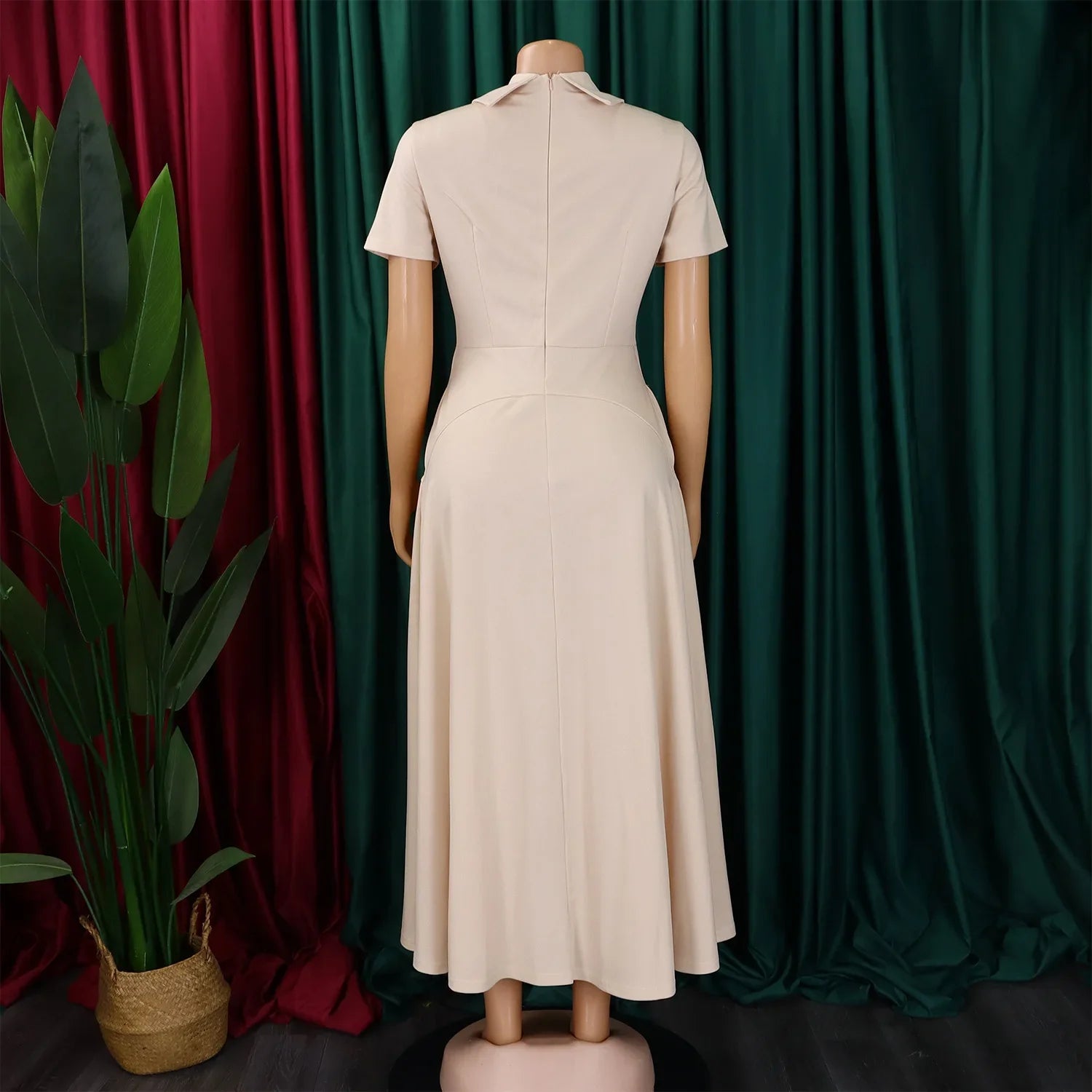 Versatile women's high-waisted evening dress in solid colour, demonstrating a flattering silhouette tailored for modern elegance.