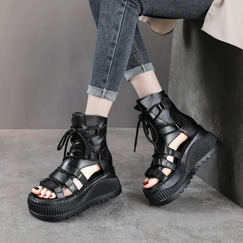 A stunning pair of Koznoy ethnic-style wedge ankle booties in brown cow leather, emphasizing premium craftsmanship and perfect fit for elegant summer attire.