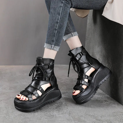 A stunning pair of Koznoy ethnic-style wedge ankle booties in brown cow leather, emphasizing premium craftsmanship and perfect fit for elegant summer attire.