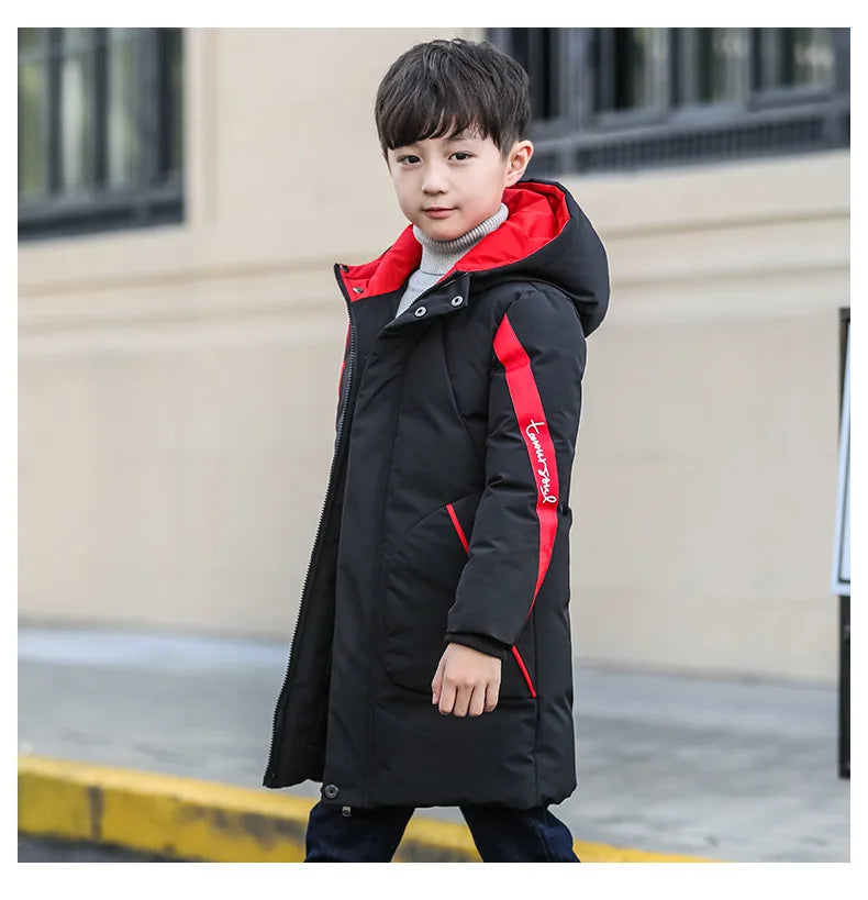 Boutique-quality boys camouflage winter coat with zip closure, tailored for ages 5-12. A must-have warm and cozy outerwear piece for adventurous young fashionistas.
