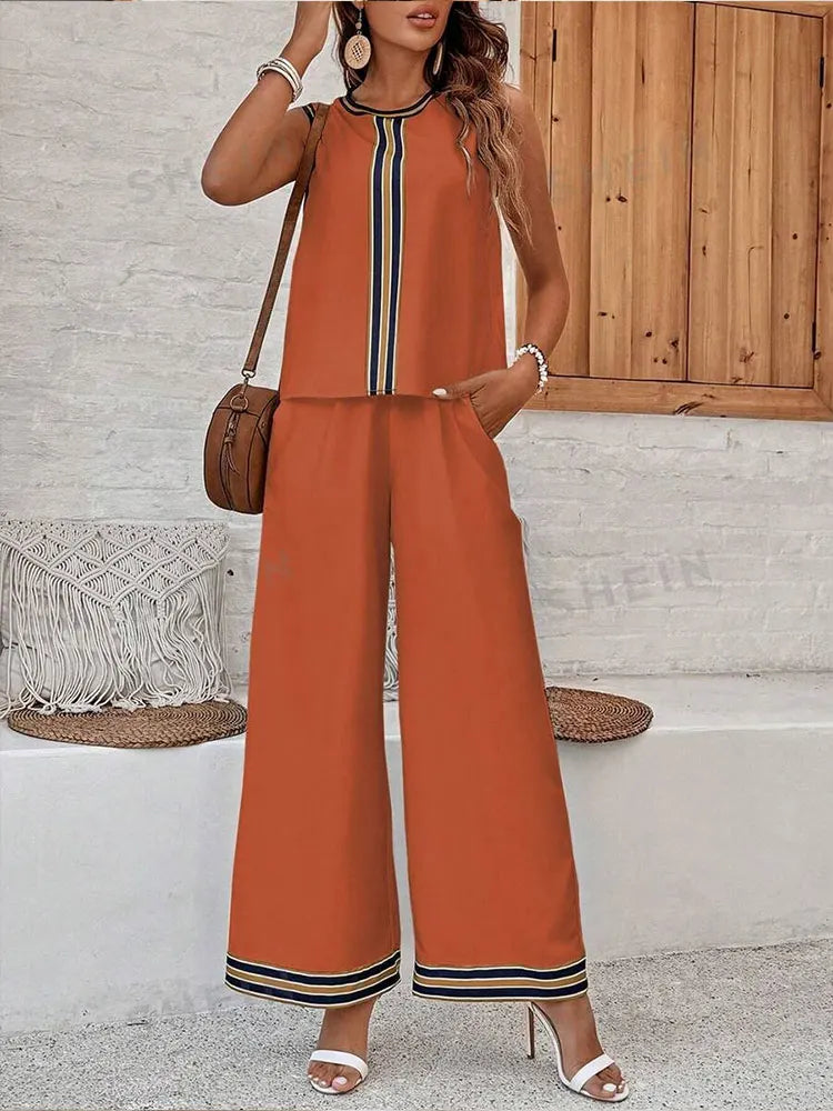 Complete view of a fashionable women's two-piece set, comprising a sleeveless top and wide leg pants, made of premium chiffon material, ideal for sophisticated summer styling.