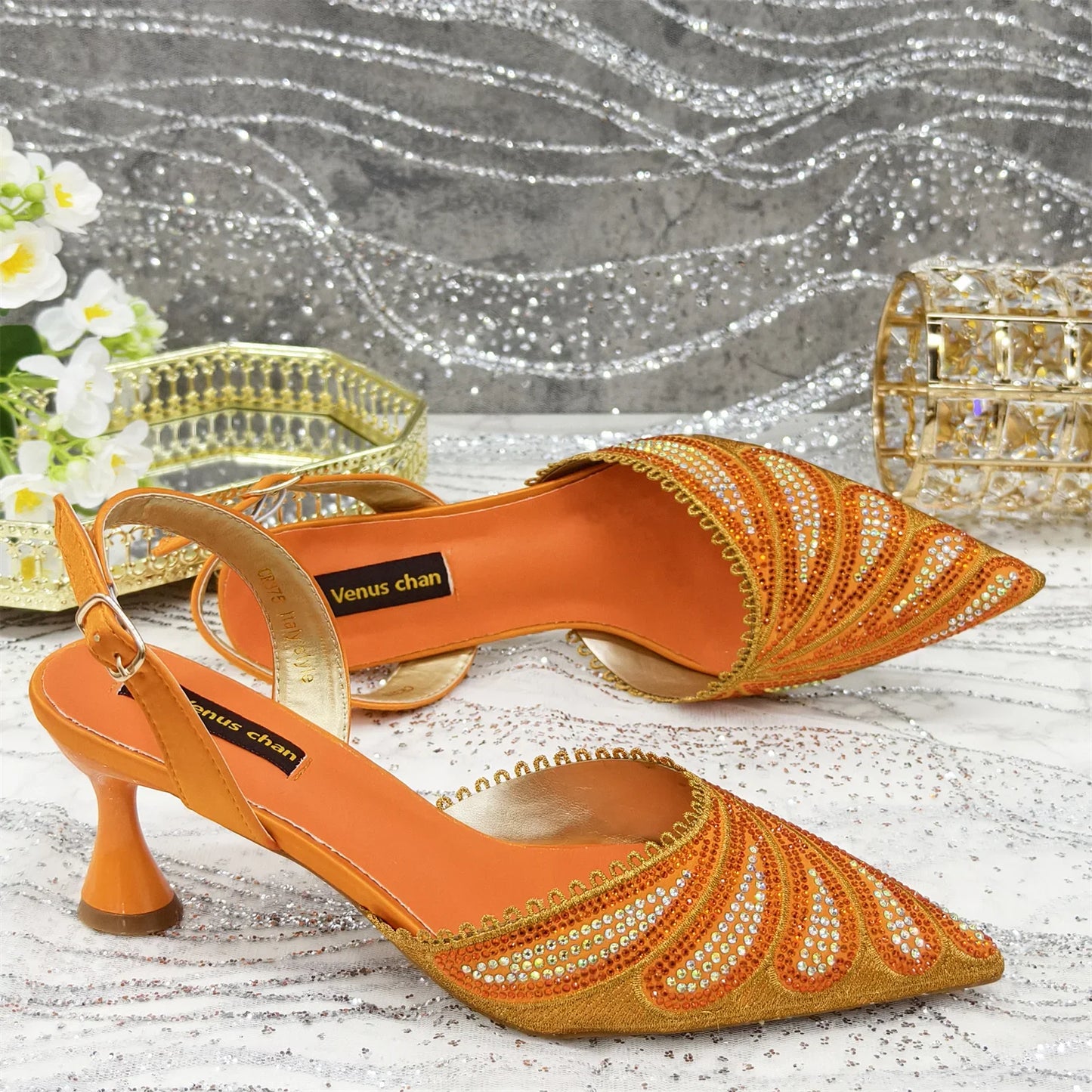 Close-up view of the elegant high heel shoe and matching handbag set, highlighting the intricate detailing and luxury finishing suited for upscale events.