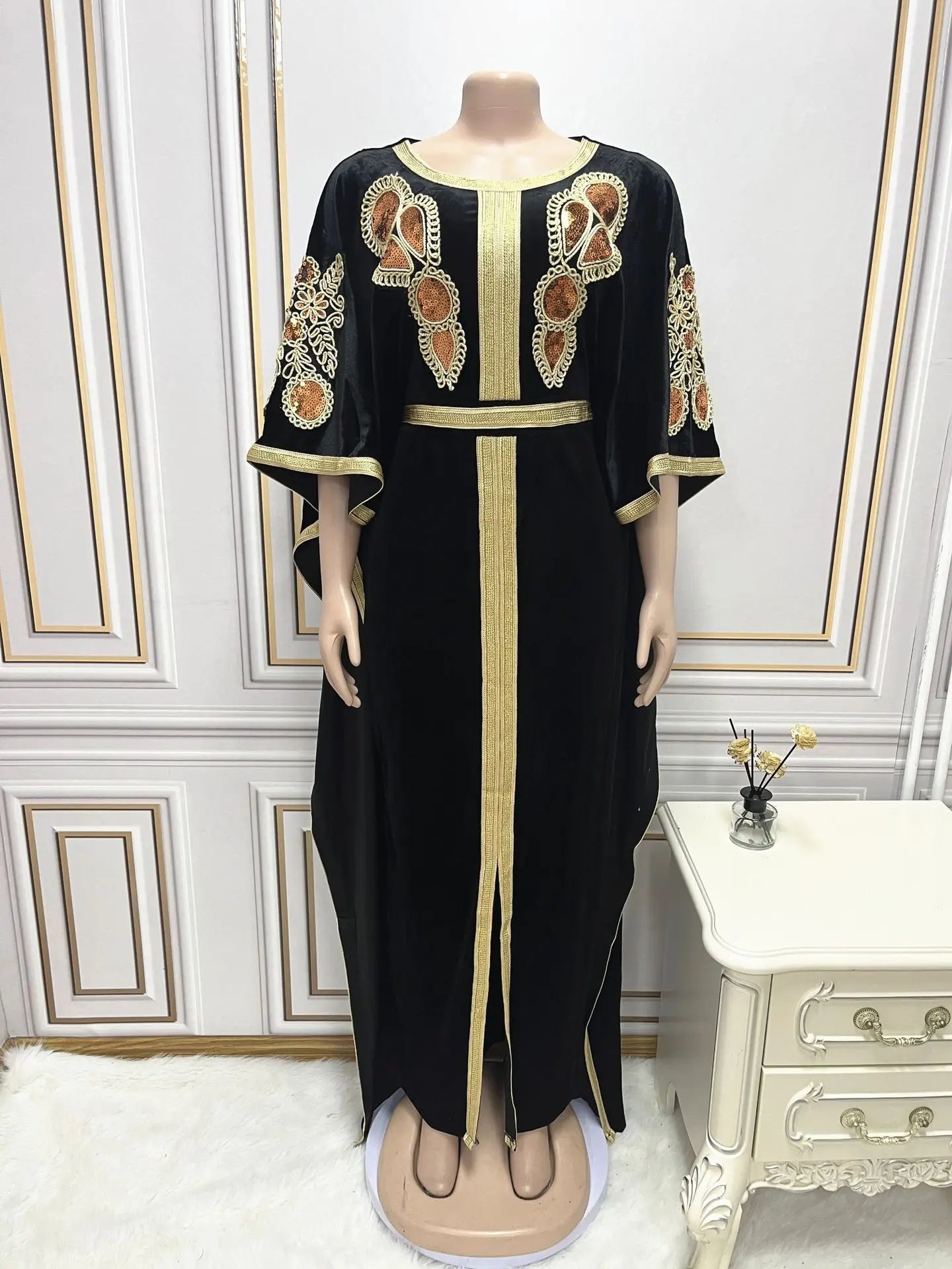 Elegant golden velvet Ramadan abaya dress featuring a bat sleeve design and intricate sequins for luxurious Muslim fashion.