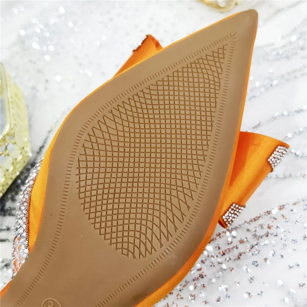 Luxurious women's party pumps with a unique crystal chain decoration and peep toe, designed for those seeking elegance and comfort in their footwear.