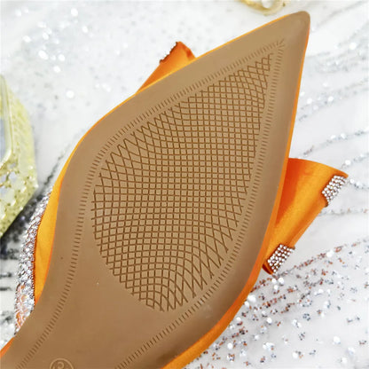 Luxurious women's party pumps with a unique crystal chain decoration and peep toe, designed for those seeking elegance and comfort in their footwear.