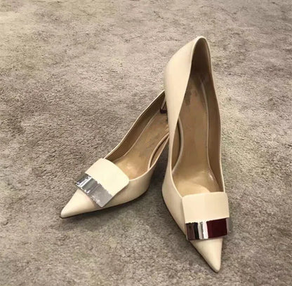 Luxury women's glitter high heel pumps with metal plate decoration, featuring a pointed toe and slender stiletto heel for elegant weddings and parties.