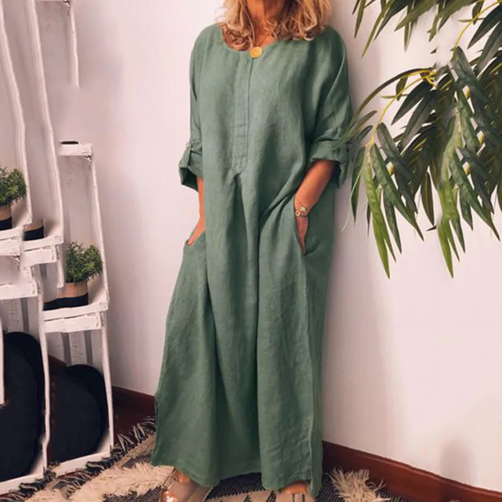 Luxurious plus size women's long sleeve maxi dress in chiffon fabric, offering an understated yet stylish appeal with a serene solid pattern and convenient pockets.