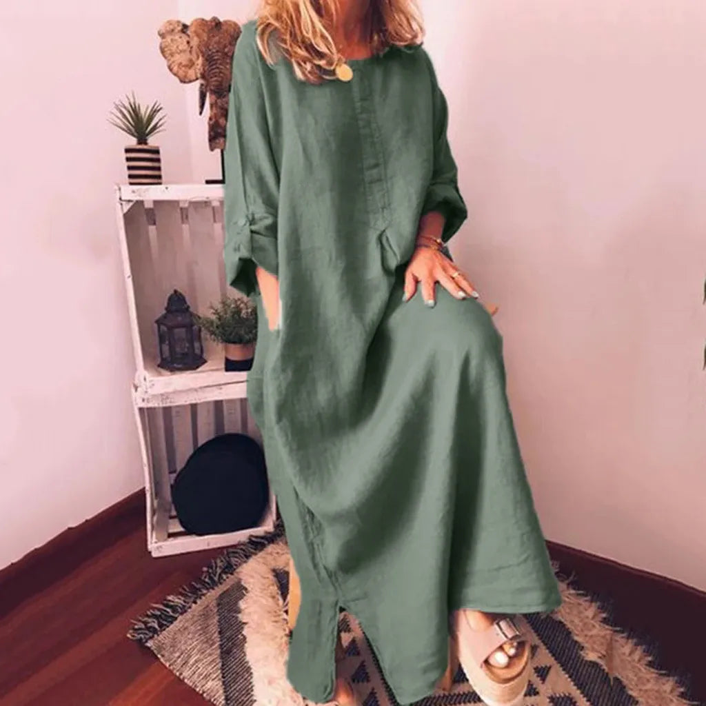 Model wearing a stylish plus size long sleeve summer maxi dress with pockets, exemplifying graceful femininity in a chic casual setting.
