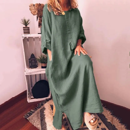 Model wearing a stylish plus size long sleeve summer maxi dress with pockets, exemplifying graceful femininity in a chic casual setting.