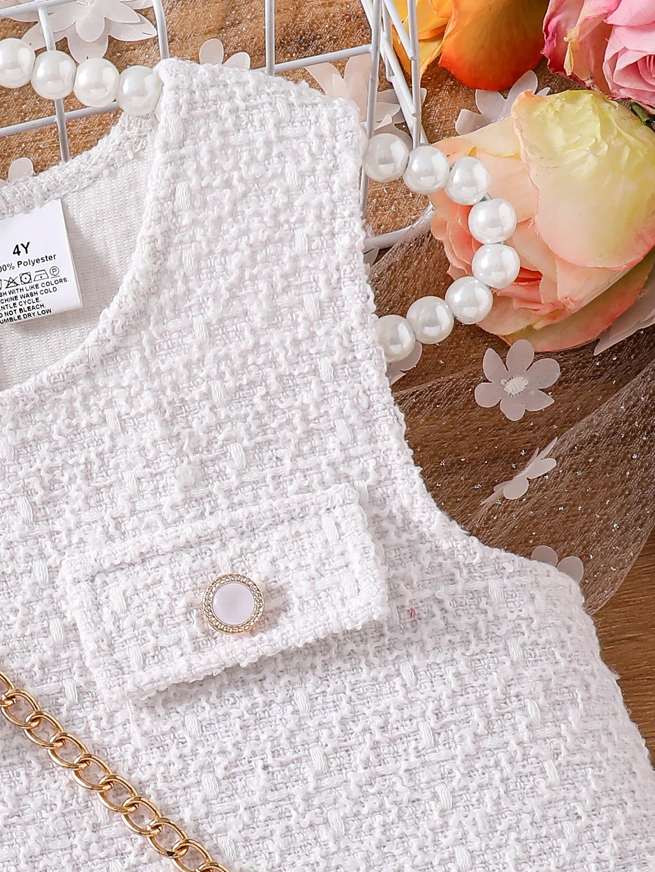 Sophisticated knee-length jumpsuit vest dress for girls, designed for Autumn wear, showcasing a pleated skirt and soft polyester material.