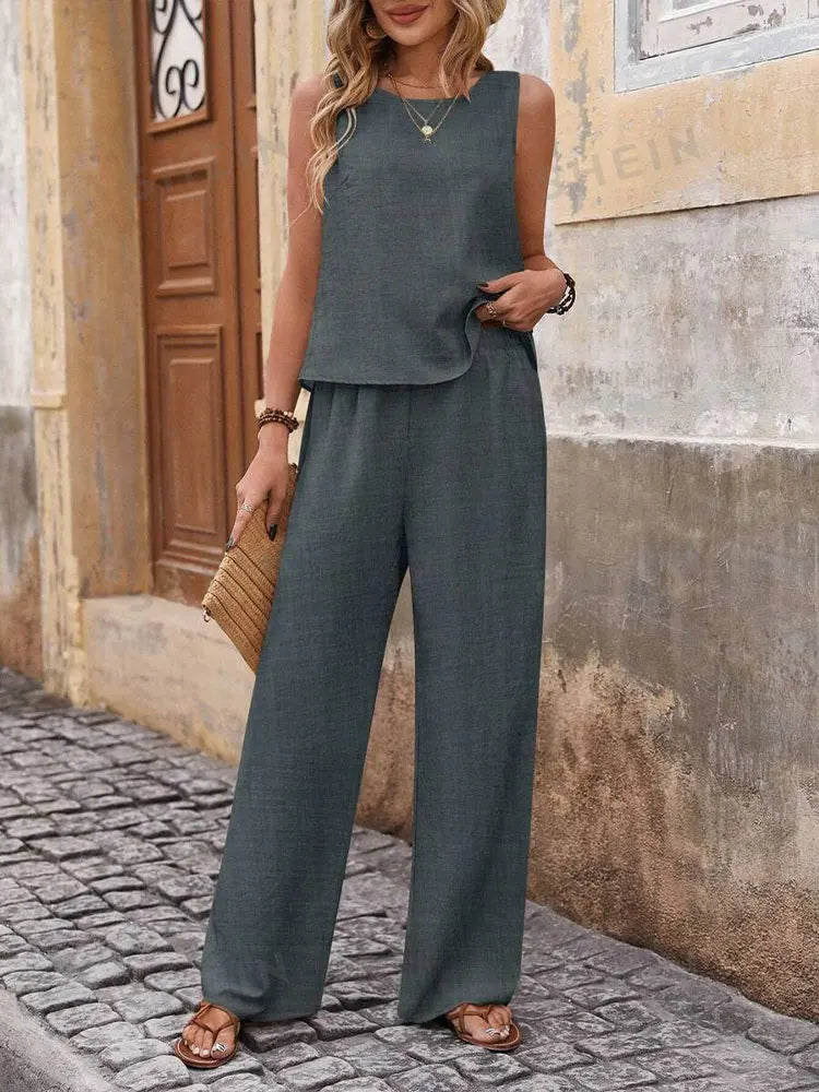 Luxurious chiffon fabric women's outfit showcasing a fashionable sleeveless top paired with elegant wide leg pants for a graceful look.