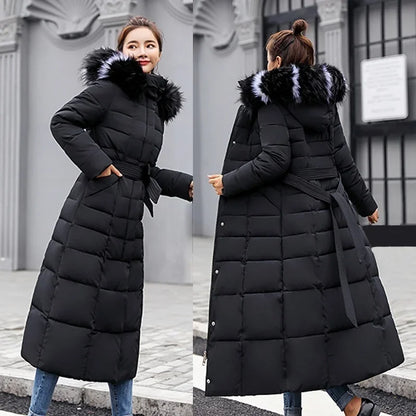 Chic women's long coat adorned with a plush fox fur collar and stylish pockets, perfect for winter elegance.