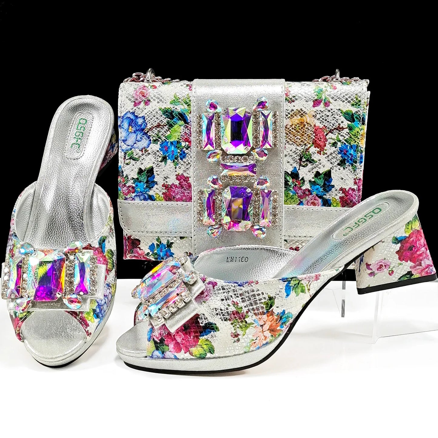 Elegant purple peep toe sandals featuring luxurious rhinestone details and a sleek slip-on design for women.