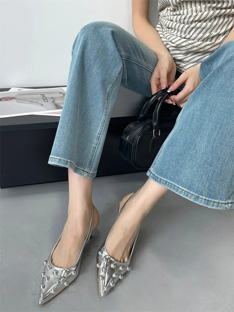 Luxury high heeled pumps adorned with rivets, designed for comfort and elegance, suitable for adult women.