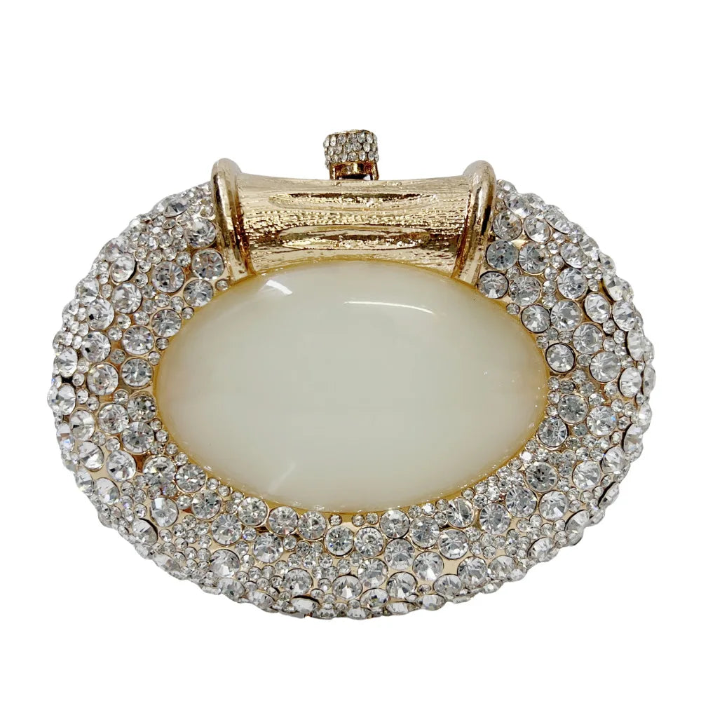 Sleek metallic clutch bag with a minimalist design, embellished with crystals for a luxurious evening accessory.