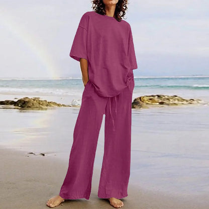 Elegant women's casual ensemble showcasing a relaxed lace-up O-neck top paired with sophisticated wide leg trousers, designed for comfort and chic summer outings.