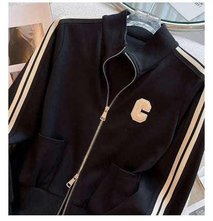 Trendy women's two-piece sports set showcasing an exquisitely embroidered coat and comfortable wide-leg pants, designed for sophisticated casual wear.