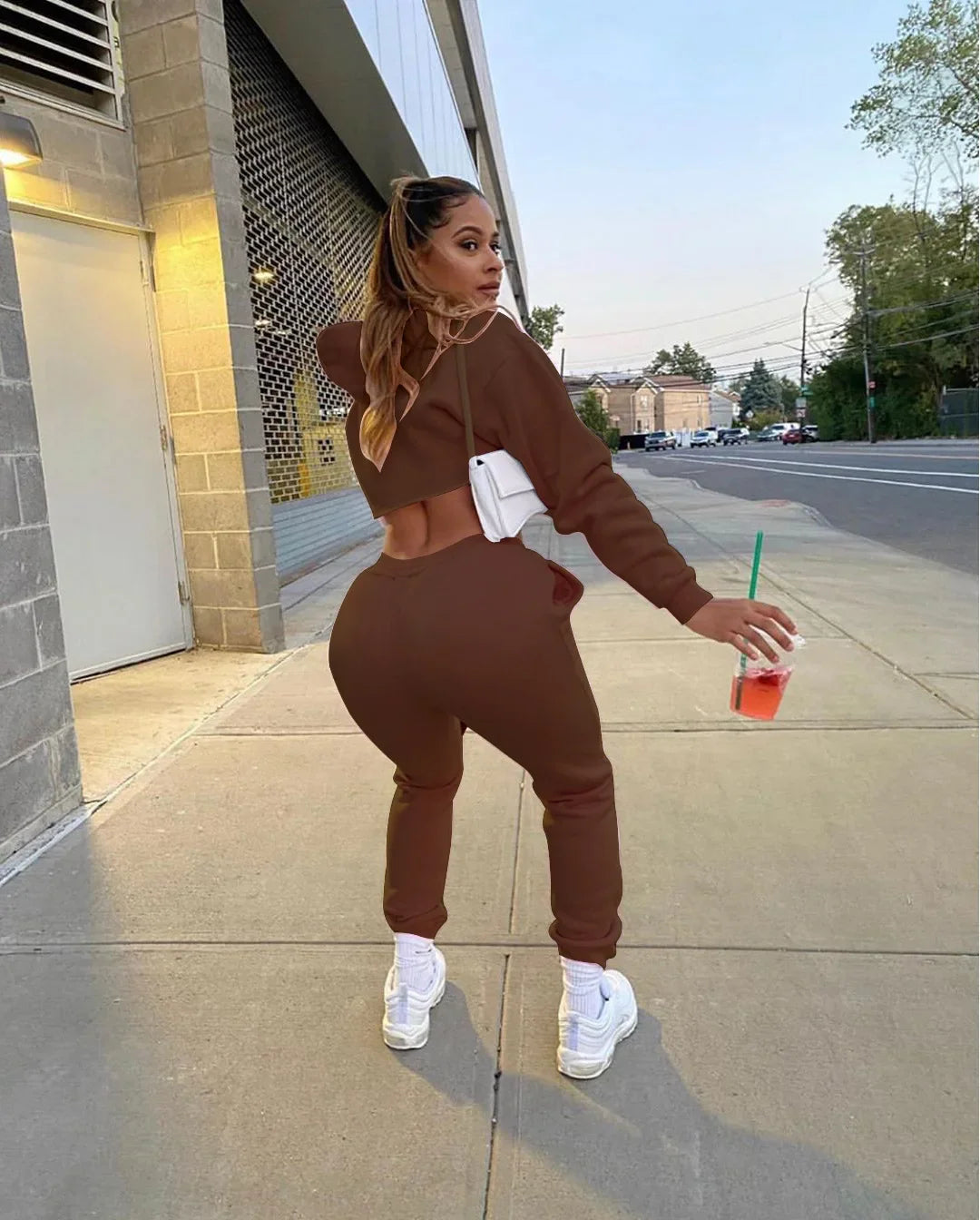 Luxury pink fleece running set for women featuring a long sleeve cropped hoodie and stylish jogger tracksuit, perfect for sporty elegance.