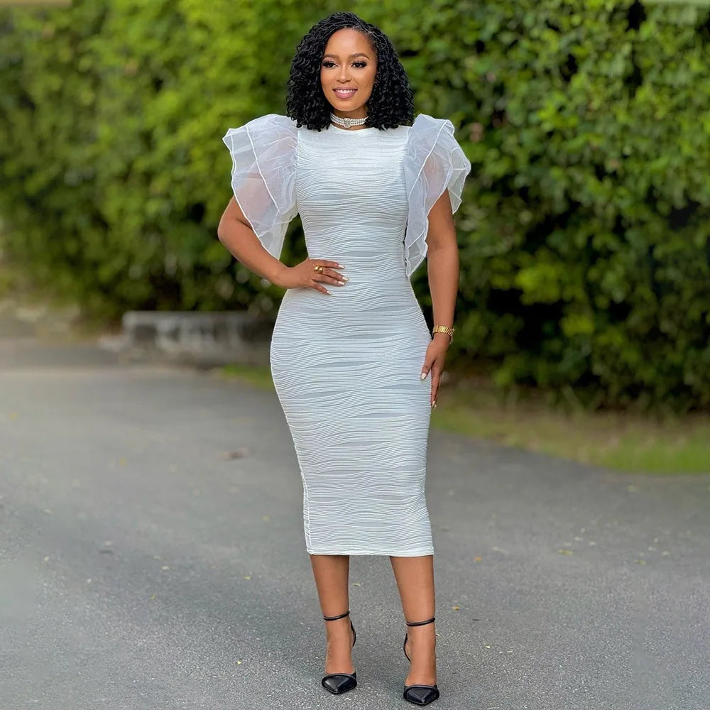 Elegant CM.YAYA women's dress displayed on a model, highlighting its flattering empire waistline and butterfly sleeve design.