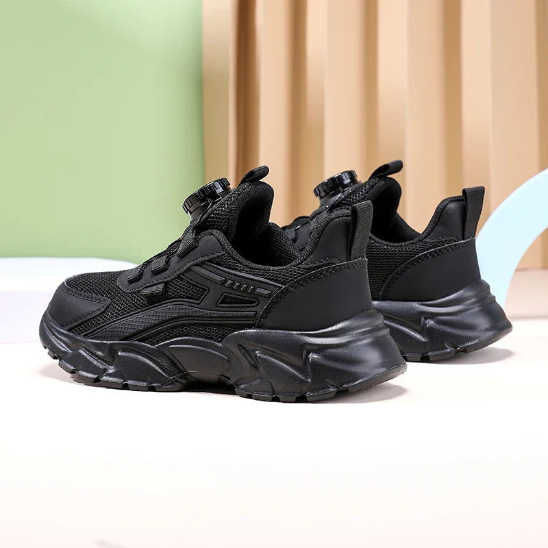 Luxurious boys' casual sports sneakers in sleek black, emphasizing breathability and anti-slip features for safe and stylish outdoor activities.