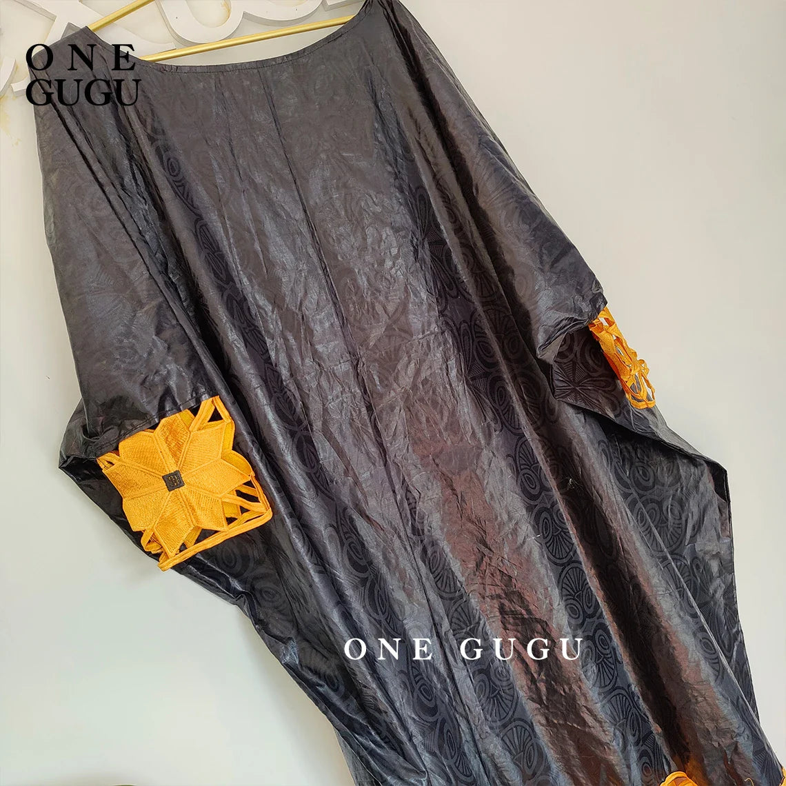 Elegant luxury gold and white African Bazin dress robe for women, showcasing intricate embroidery and lace details, perfect for parties and special occasions.