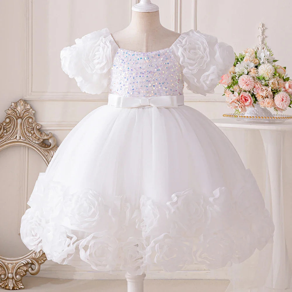 Elegant floral appliqué design on a cute tulle party gown for girls aged 4-10, exuding charm and sophistication.