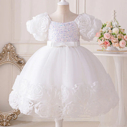 Elegant floral appliqué design on a cute tulle party gown for girls aged 4-10, exuding charm and sophistication.