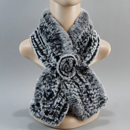 Close-up view of women's luxurious knit faux fur hat, highlighting its intricate design and premium materials, ideal for winter fashion.