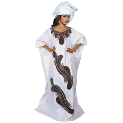 Detail shot of the intricate fabric texture of an African Dashiki Gown, highlighting the quality cotton material and exquisite decorative elements suitable for elegant occasions.