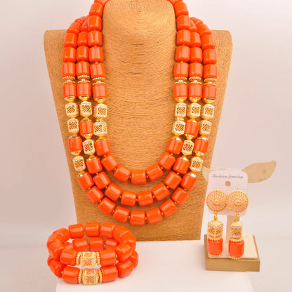 Elegant Nigerian bridal jewelry set featuring artificial coral beads in a luxurious design, including necklace, bracelet, and earrings.