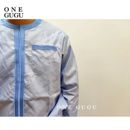 Premium waterproof African 2-piece men's set featuring a luxurious blue cotton shirt and matching pants with intricate Nigerian Dashiki design, sizes L-2XL.