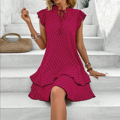 Flat lay of the elegant women's casual ruffle mini dress, capturing its beautiful print pattern and luxurious material, perfect for transitional spring and summer styling.