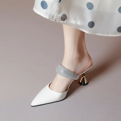 Luxury women’s pointed toe sandals with a crystal adorned heel, combining comfort and elegance for sophisticated summer wear.