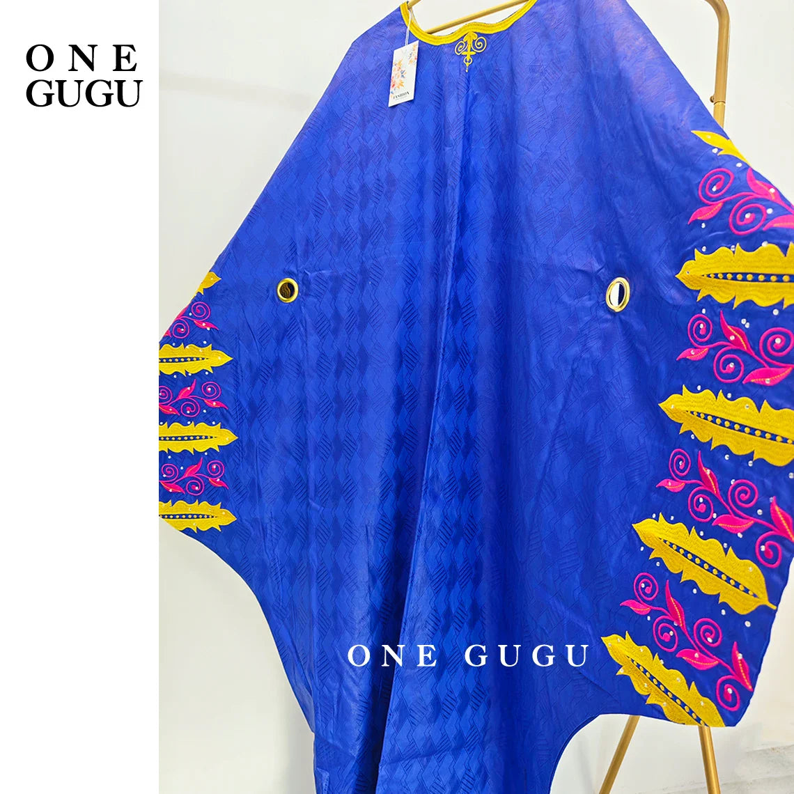 Close-up of elegant embroidery and decorative stones on the Luxury Royal Blue Bazin Riche Boubou Dress, showcasing its exquisite craftsmanship.