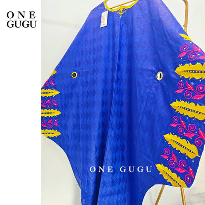 Close-up of elegant embroidery and decorative stones on the Luxury Royal Blue Bazin Riche Boubou Dress, showcasing its exquisite craftsmanship.