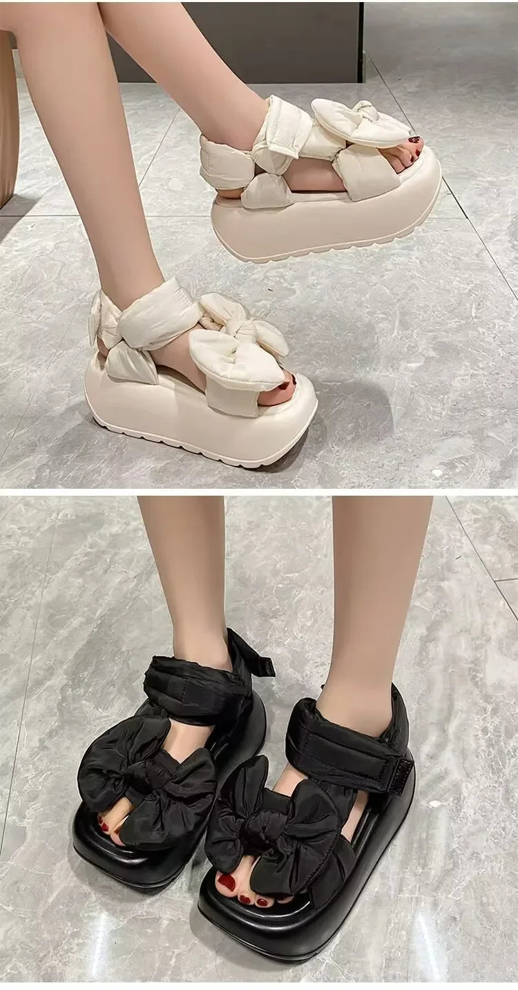 Elegant gladiator sandals in black leather with intricate butterfly-knot accents, designed for comfort and style during casual outings.