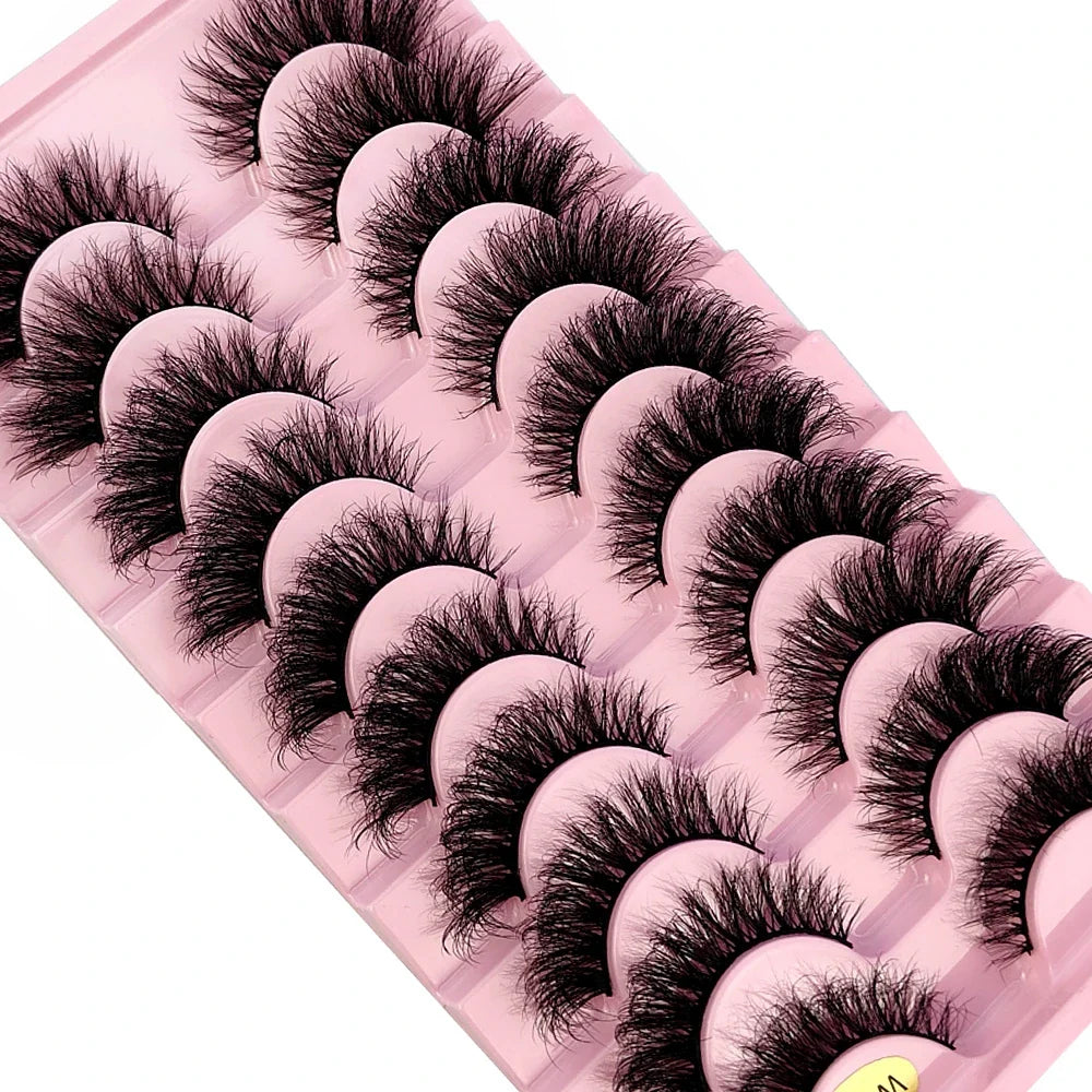 A stunning display of 10 pairs of high-quality mink strip lashes, perfect for creating a bold statement in makeup artistry.
