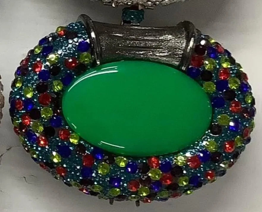 Close-up view of the exquisite metallic finish of a clutch bag, featuring intricate crystal embellishments for a stunning evening look.