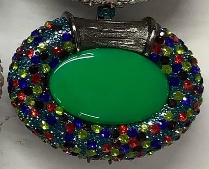 Close-up view of the exquisite metallic finish of a clutch bag, featuring intricate crystal embellishments for a stunning evening look.