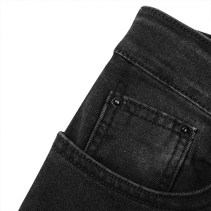 Close-up of the exquisite soft fabric of luxury skinny ripped denim jeans, showcasing an impeccable and fashionable design.