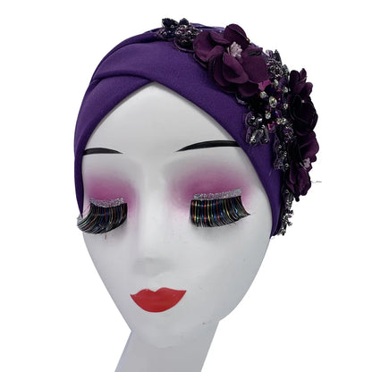 Luxury African hijab cap demonstrating intricate weaving techniques and adorned with diamond-like embellishments, suitable for middle-aged women.