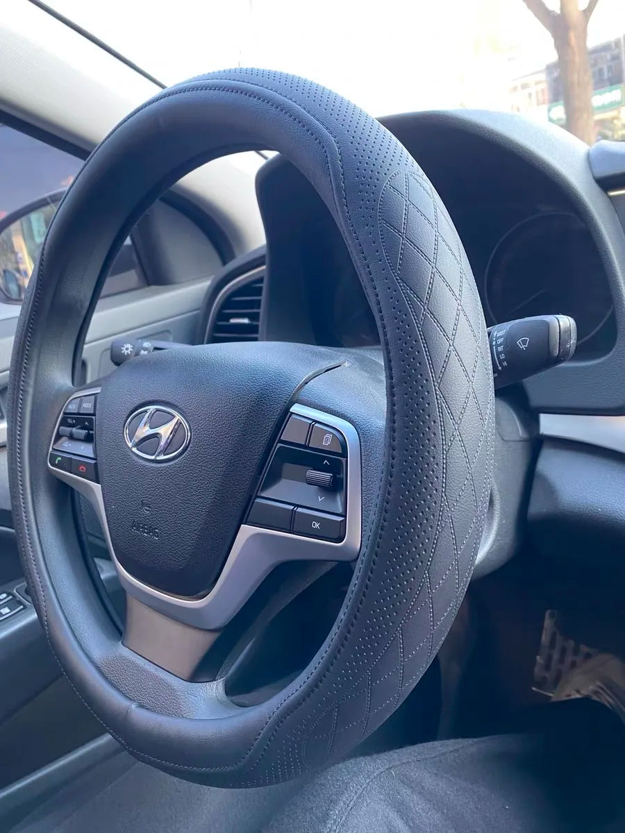 Luxury Napa Leather Perforated Patchwork Steering Wheel Cover showcasing elegant design and premium quality, perfect for enhancing driving comfort.