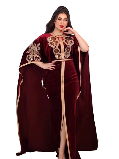 Elegant model wearing a golden velvet bat sleeve abaya, radiating sophistication and grace in Muslim fashion for special occasions.