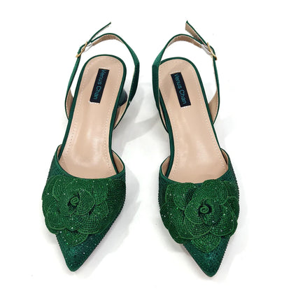 Stylish women's slingback pumps with a chic pointed toe design, complemented by a fashionable handbag and floral embellishments, ideal for spring and summer events.
