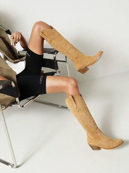 Elegant brown PU leather knee-high pointed toe knight boots for women, showcasing a fashionable western cowboy design.