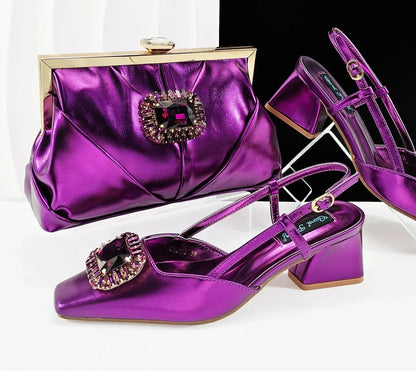 A stylish long chain shoulder bag set with matching rhinestones, perfect for pairing with luxury coffee slingback pumps.