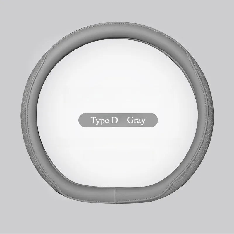 Sophisticated patchwork design of the Napa leather steering wheel cover, emphasizing its luxury and comfort features.