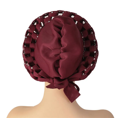 Glamorous African headtie with intricate design, perfect for special occasions and showcasing elegance in women's attire.