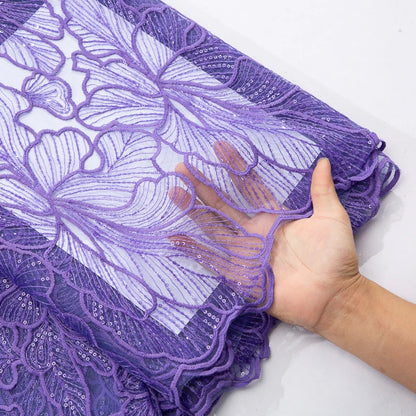 Beautifully crafted African Milk Silk Lace Fabric, adorned with sequins, perfect for bespoke wedding designs that exude elegance and charm.